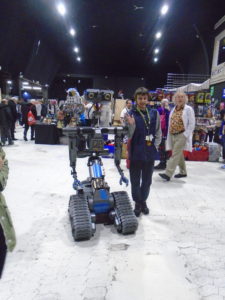 Beaumont student with robot at expo