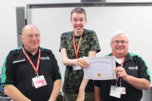 Student receiving certificate from St Johns' Ambulance