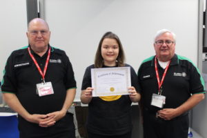 Student receiving certificate from St Johns' Ambulance