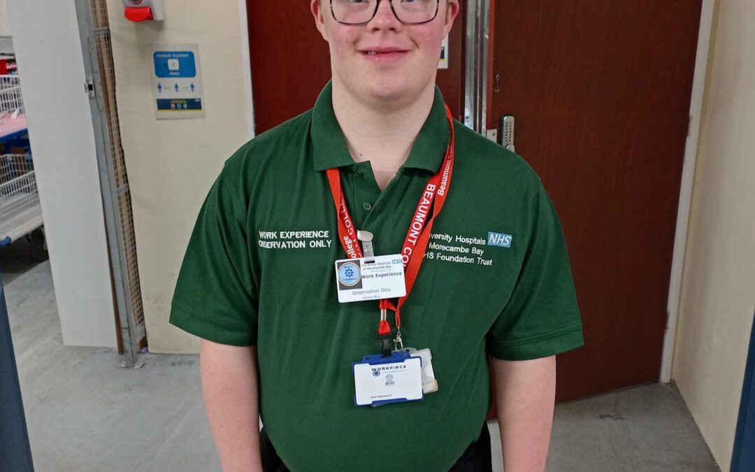 Sean in his Royal lancaster infirmary uniform. Green polo shirt and black trousers.