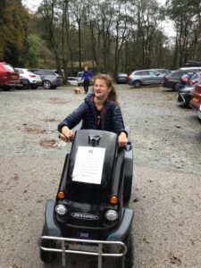 Beaumont student outdoors on mobilised scooter