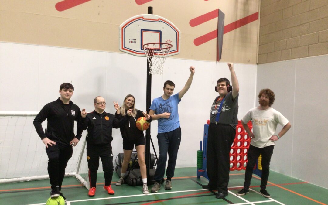 Students and staff stood in the sports hall at the leisure centre